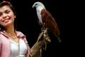 Hawk sitting on falconer's woman hand Royalty Free Stock Photo