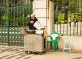 A hawker selling roasted chestnuts in Lisbon, Portugal