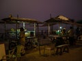 Hawkers selling street snacks and fast food on the Indian beach. Families spend leisure time on beaches