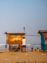 Hawkers selling street snacks and fast food on the Indian beach. Families spend leisure time on beaches