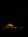 Hawkers selling street snacks and fast food on the Indian beach at night. Families spend leisure time on beaches