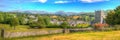 Hawkshead the Lake District Cumbria in summer with blue sky church and red roses panoramic view Royalty Free Stock Photo