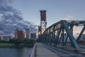 Hawthorne Bridge over Willamette River at sunset with skyline of downtown Portland, USA Royalty Free Stock Photo
