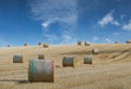 Hay bale harvesting in golden field landscape