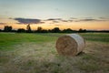 Hay bale in the meadow and the evening sky, Nowiny, Poland Royalty Free Stock Photo