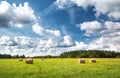 Hay bales with blue sky and fluffy clouds Royalty Free Stock Photo