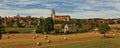 Hay bales and church in Martel, Lot, France