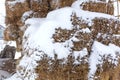 Hay bales crushed by snow close up