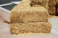 Hay Bales.  Piled stacks of dry straw collected for animal feed. Dry baled hay bales stack. Hay Bales piled up for Seating and Royalty Free Stock Photo