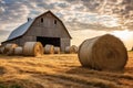 hay bales stacked beside a wooden barn Royalty Free Stock Photo