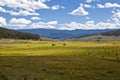 Hay Bales and Tractors in a Colorado Pasture Royalty Free Stock Photo