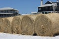 Hay bales on white sand beach for oil cleanup Royalty Free Stock Photo