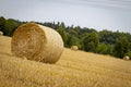 Hay bundles on a harvested field Royalty Free Stock Photo