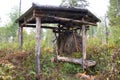 Hay feeder for wild animals - elk, deer, roe deer in the forest Royalty Free Stock Photo