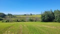 Hay fields with a swamp in the middle Royalty Free Stock Photo