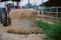 Hay in front of tractor Royalty Free Stock Photo