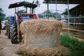 Hay in front of tractor Royalty Free Stock Photo