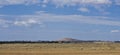 Hay meadow under hill near Dubbo, New South Wales, Australia. Royalty Free Stock Photo