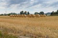 Hay round bales in field on a hot summer day against the blue sky, Catalonia village Royalty Free Stock Photo