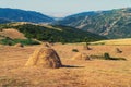 Hay stack on a hillside Royalty Free Stock Photo