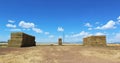 Hay stacks on a field Royalty Free Stock Photo