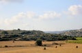 Hay stacks on the field and windmills