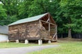 hay storage barn with green trees in the background Royalty Free Stock Photo