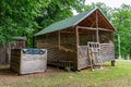 hay storage barn with green trees in the background Royalty Free Stock Photo