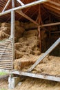 hay storage barn with green trees in the background Royalty Free Stock Photo