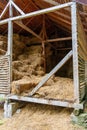 hay storage barn with green trees in the background Royalty Free Stock Photo