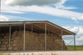 The hay storage shed full of bales hay on farm. Royalty Free Stock Photo