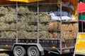 Hay and straw in a truck. Hay for cows, horses, goats and sheep. ÃÂgricultural, harvest and farming concept