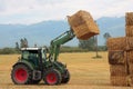 Hay tractor stacking hay bales