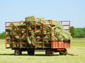 Fully loaded red hay wagon with square haybales Royalty Free Stock Photo
