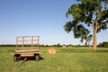 Hay Wagon and Hay Bale in Field Under Large Tree