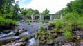 Waterfall and ford on the country lane near Pennant below Gospel Pass and Lord Hereford`s Knob, near Hay-on-Wye, Wales Royalty Free Stock Photo