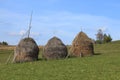 Hayricks in a mountainous area Royalty Free Stock Photo