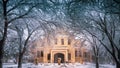 Hays, KS USA - Fort Hays State University`s Picken Hall Front peeking through Snow Covered Tree Branches