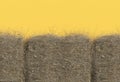 Haystack closeup isolated on yellow background with copy space. Top view. 3D render of straw.