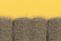 Haystack closeup isolated on yellow background with copy space. Top view. 3D render of straw. Royalty Free Stock Photo