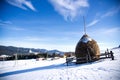 Haystack at dawn in winter mountains