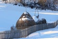 Haystack at dawn in winter mountains