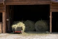 Haystack, a group of hay bales. Agricultural farm. The harvest period with dry hay, a pile of dry grass, straw