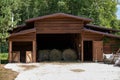 Haystack, a group of hay bales. Agricultural farm. The harvest period with dry hay, a pile of dry grass, straw