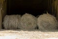 Haystack, a group of hay bales. Agricultural farm. The harvest period with dry hay, a pile of dry grass, straw