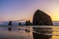 Haystack Rock at dusk, iconic natural landmark of the Oregon Coast, Cannon Beach, USA Royalty Free Stock Photo