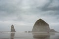 Haystack Rock In The Mist Of A Cloudy Morning On Cannon Beach Royalty Free Stock Photo