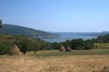 Haystacks fields iron gates danube river Royalty Free Stock Photo