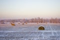 Haystacks on the frozen field Royalty Free Stock Photo