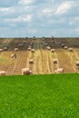 Haystacks harvest on agriculture farm fields. Farm field bales agriculture landscape. Haystack harvest landscape. The beet field Royalty Free Stock Photo